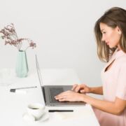 woman sitting at computer experiencing a slump