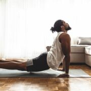 man engaging in yoga as a healthy habit